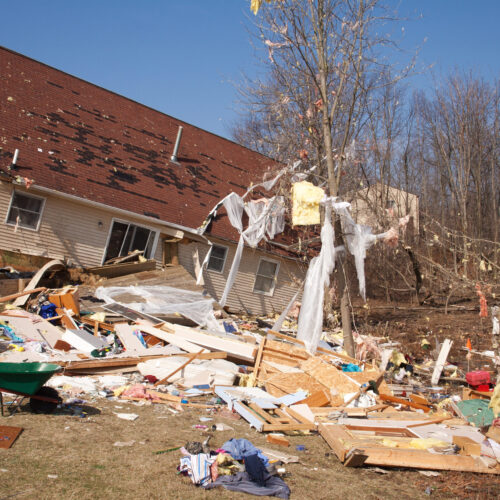 Image of a home heavily damaged by an F2 tornado that swept through Oregon Twp in Lapeer County, MI on March 15, 2012. The house was lifted from its foundation. The photo was taken the next day on March 16, 2012.
